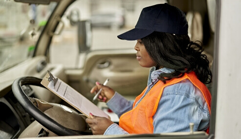 Photo of a driver with checklist